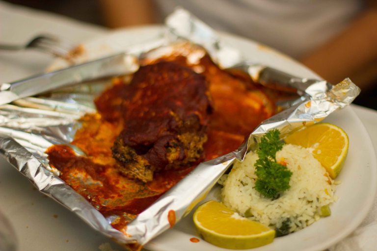 Huachinango (red snapper) baked in a brick oven topped with a chili butter.