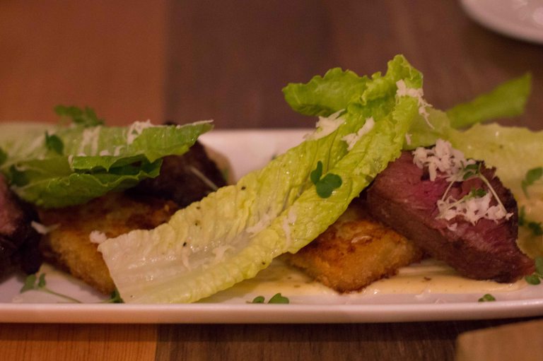 Medium rare beef short rib with potato and cheddar terrine, caesar aioli, romaine and horseradish