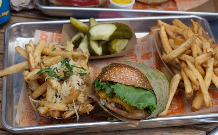 Super Duper Burger with a side of many pickles and fries. No the garlic fries in the photo were not mine. I'd never do that before I got on a plane...