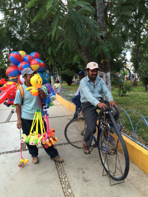 BIcycle knife sharpener happily working away in the plaza.