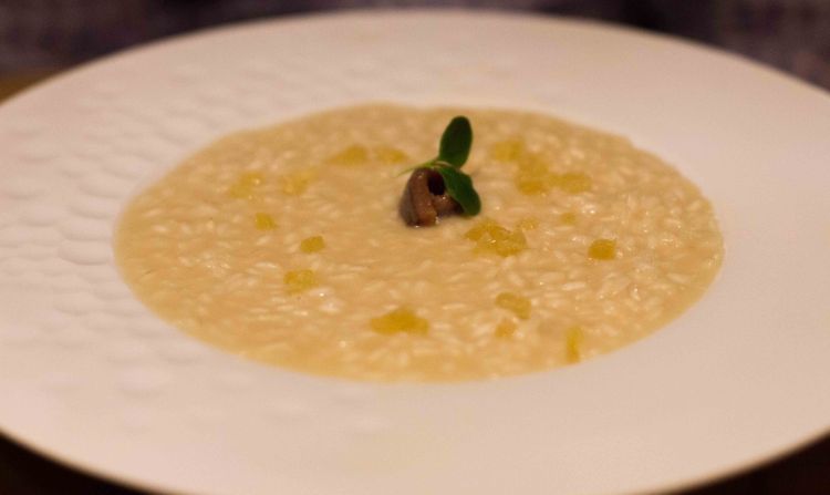 Risotto with butter, anchovies from Cantabrian Sea and candied ginger 