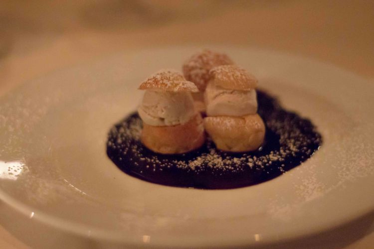 Profiteroles on chocolate sauce